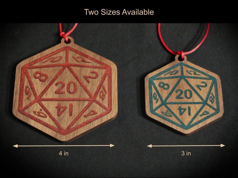 Black Walnut Christmas ornaments in 3 and 4 inches sizes, in the style of a D20 dice, with green and red resin infilled engravings.